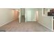Large basement with a staircase and carpet, suitable for various activities and storage needs at 513 Shadow Valley Ct, Lithonia, GA 30058