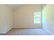 Bedroom with a window and neutral carpet at 513 Shadow Valley Ct, Lithonia, GA 30058
