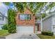Charming two-story brick home with a well-maintained lawn and attached garage in a quiet neighborhood at 513 Shadow Valley Ct, Lithonia, GA 30058