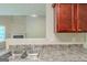 Close up of the kitchen sink and countertop with partial view to living room at 513 Shadow Valley Ct, Lithonia, GA 30058