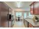 Well-lit kitchen and dining area with stainless steel appliances, ample counter space and a view of the backyard at 513 Shadow Valley Ct, Lithonia, GA 30058