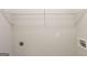 Walk-in closet with shelving and outlet for laundry appliances at 513 Shadow Valley Ct, Lithonia, GA 30058