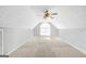 Spacious attic featuring a ceiling fan and an arched window, providing natural light at 950 Besse Way, Locust Grove, GA 30248
