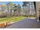 Spacious backyard with a patio and mature trees offering shade at 950 Besse Way, Locust Grove, GA 30248
