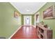 Bright foyer with hardwood floors, decorative accents, and an inviting entryway at 950 Besse Way, Locust Grove, GA 30248