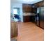 Traditional kitchen with wood cabinets, stainless steel appliances, and light wood-look flooring at 950 Besse Way, Locust Grove, GA 30248