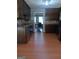 Traditional kitchen with wood cabinets, stainless steel appliances, and light wood-look flooring at 950 Besse Way, Locust Grove, GA 30248
