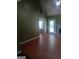 Bright living room with fan and view into another room at 950 Besse Way, Locust Grove, GA 30248