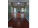 Open living room with fireplace, ceiling fan, and hardwood floors at 950 Besse Way, Locust Grove, GA 30248