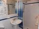 Bathroom featuring a pedestal sink, mirror, and shower with blue-striped curtain at 1253 Gatewood Drive Dr, Lawrenceville, GA 30043