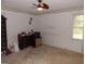 Spacious bedroom featuring a ceiling fan and a window for natural light at 1253 Gatewood Drive Dr, Lawrenceville, GA 30043