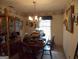 Traditional dining room featuring a wooden table, hutch, and decorative wallpaper, offering a warm and inviting atmosphere at 1253 Gatewood Drive Dr, Lawrenceville, GA 30043