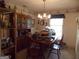 Traditional dining room with a wooden table, china cabinet, and decorative wallpaper, ideal for Gathering gatherings at 1253 Gatewood Drive Dr, Lawrenceville, GA 30043