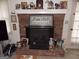 Classic brick fireplace with a white mantel, decorative accents, and a cozy ambiance, enhancing the home's charm at 1253 Gatewood Drive Dr, Lawrenceville, GA 30043