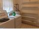 Laundry area with washer, dryer, and shelving for storage at 1253 Gatewood Drive Dr, Lawrenceville, GA 30043