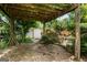 Backyard featuring an outdoor covered parking area near shed for potential additional parking at 1587 Cronic Town Rd, Auburn, GA 30011