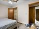 Bedroom features ceiling fan and closet at 1587 Cronic Town Rd, Auburn, GA 30011
