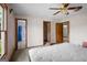 This bedroom features a ceiling fan, a closet, and an ensuite bath at 1587 Cronic Town Rd, Auburn, GA 30011