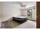Neutral bedroom with ceiling fan and natural light at 1587 Cronic Town Rd, Auburn, GA 30011