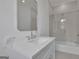 Clean bathroom with marble countertops, a glass shower door, and tile floors at 3893 Indian Shoals Road, Dacula, GA 30019