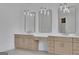 This bathroom features a double vanity with decorative lighting and a walk-in shower at 3893 Indian Shoals Road, Dacula, GA 30019