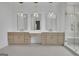 This bathroom features a double vanity with decorative lighting and a walk-in shower at 3893 Indian Shoals Road, Dacula, GA 30019