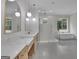 Bathroom showcasing a luxurious soaking tub, walk-in shower, and marble countertops at 3893 Indian Shoals Road, Dacula, GA 30019
