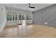This primary bedroom features hardwood floors and natural light at 3893 Indian Shoals Road, Dacula, GA 30019