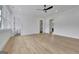Spacious bedroom with hardwood floors leading to a bathroom and closet at 3893 Indian Shoals Road, Dacula, GA 30019