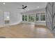 This primary bedroom features hardwood floors, natural light, and decorative accents at 3893 Indian Shoals Road, Dacula, GA 30019