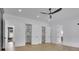 This primary bedroom features hardwood floors and custom walk-in closets at 3893 Indian Shoals Road, Dacula, GA 30019