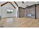 Bonus room with vaulted ceilings, wood floors, a linear fireplace, and lots of light at 3893 Indian Shoals Road, Dacula, GA 30019