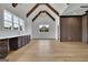 Bonus room with vaulted ceilings, dark cabinets, wood floors, and lots of light at 3893 Indian Shoals Road, Dacula, GA 30019