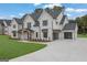 Gorgeous two-story home with a sleek garage and a well-maintained lawn at 3893 Indian Shoals Road, Dacula, GA 30019