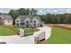 Beautifully designed home with a gated entrance, lush landscaping, and long driveway at 3893 Indian Shoals Road, Dacula, GA 30019