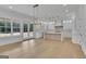 Well-lit kitchen with white cabinets, an island, and hardwood floors at 3893 Indian Shoals Road, Dacula, GA 30019