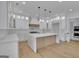 Modern kitchen with white cabinets, quartz countertops, and stainless steel appliances at 3893 Indian Shoals Road, Dacula, GA 30019