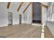 A bedroom with a fireplace, two closets, ceiling beams and recessed lighting at 3893 Indian Shoals Road, Dacula, GA 30019