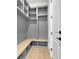 Mudroom with bench seating, storage cubbies, and gray colored walls at 3893 Indian Shoals Road, Dacula, GA 30019