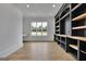 Office with wood floors, lots of light, built-in shelving, and a small desk at 3893 Indian Shoals Road, Dacula, GA 30019