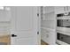Walk-in pantry boasts custom shelving, countertops, and lots of storage space at 3893 Indian Shoals Road, Dacula, GA 30019
