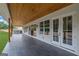 Covered patio features a full outdoor kitchen and recessed lighting at 3893 Indian Shoals Road, Dacula, GA 30019