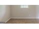 Neutral bedroom with carpet floors, natural light and neutral paint at 5207 Shawn Ln, Stone Mountain, GA 30088