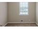 Bright bedroom featuring a window and neutral walls, providing a comfortable living space at 5207 Shawn Ln, Stone Mountain, GA 30088
