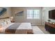 Comfortable bedroom featuring a plush bed, stylish decor, and ample natural light at 5207 Shawn Ln, Stone Mountain, GA 30088