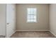 Bright bedroom with a window and neutral walls, providing a comfortable living space at 5207 Shawn Ln, Stone Mountain, GA 30088
