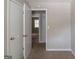 Bedroom with neutral carpet and multiple closet doors, offering ample storage space at 5207 Shawn Ln, Stone Mountain, GA 30088