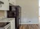 Clean kitchen with stainless steel appliances, white cabinets, and granite countertops at 5207 Shawn Ln, Stone Mountain, GA 30088
