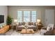 Bright living room featuring neutral tones, large windows, and stylish furnishings at 5207 Shawn Ln, Stone Mountain, GA 30088
