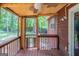 Screened-in porch with wooden planks and ceiling fan at 5207 Shawn Ln, Stone Mountain, GA 30088